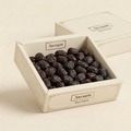 Awoam Ajwa loose-date carton concept with matching ivory cardboard lid